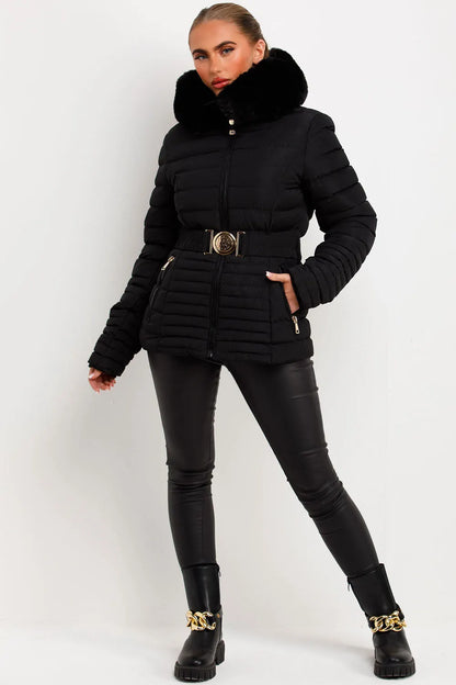 Black Puffer Jacket With Faux Fur Hood And Gold Belt